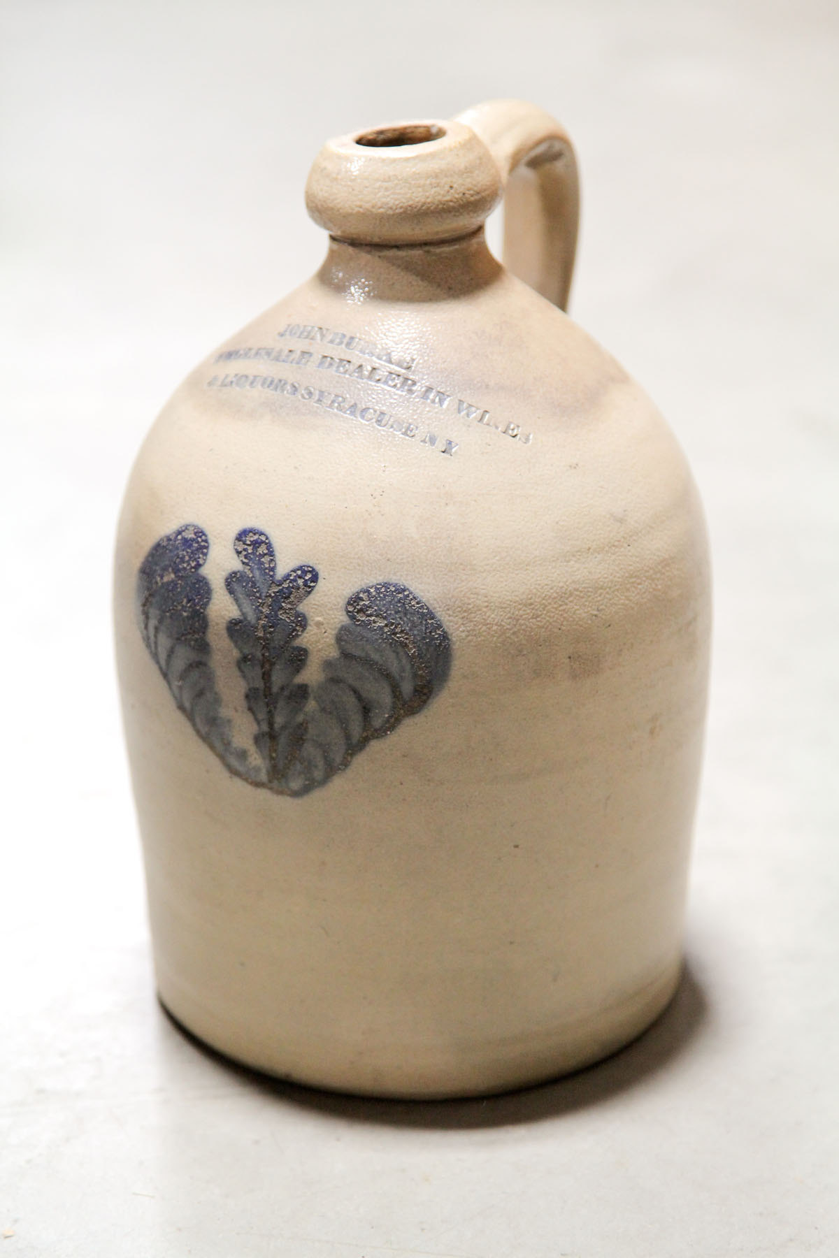 STONEWARE ADVERTISING JUG. 