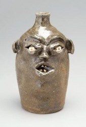 Stoneware face jug, ceramic ey