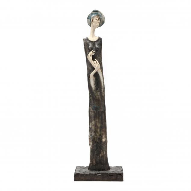 STONEWARE FIGURE OF A WOMAN,