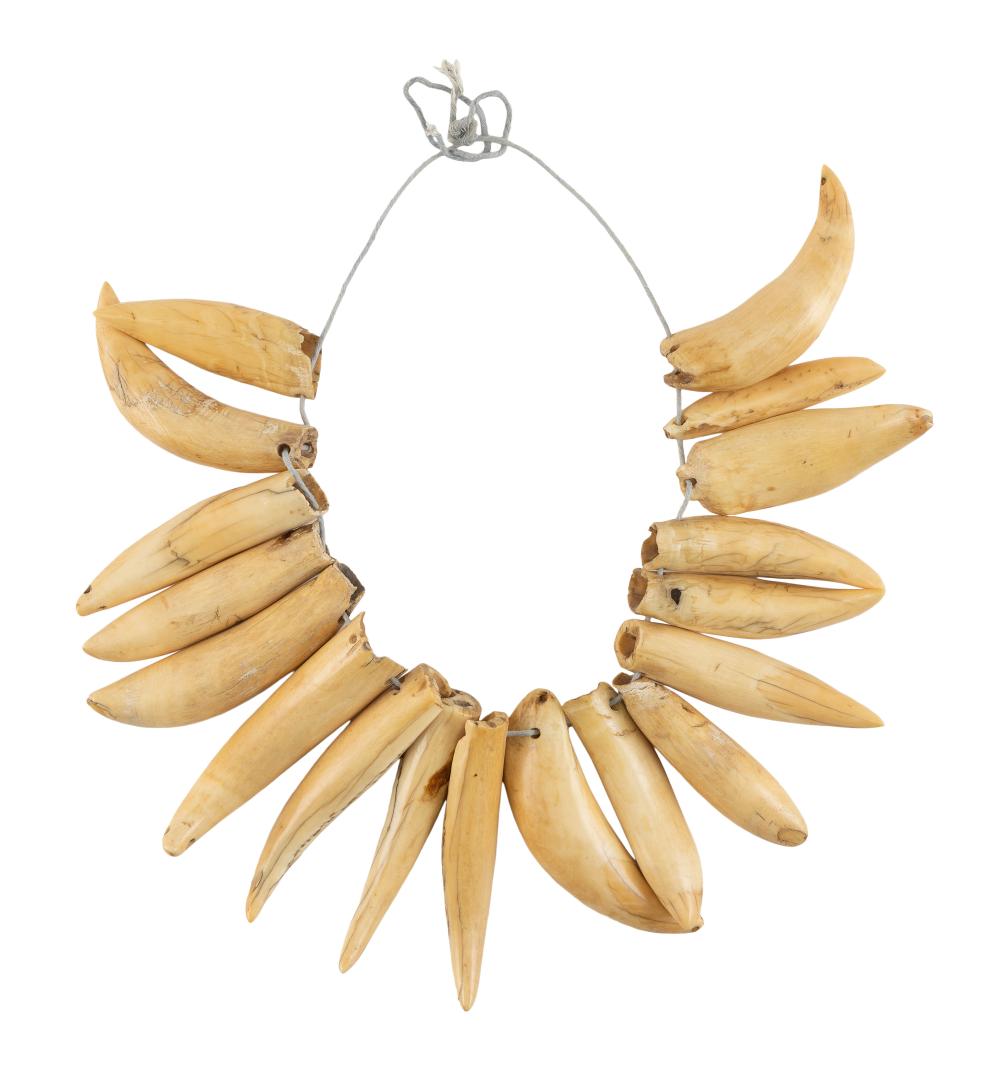 * STRAND OF SEVENTEEN WHALE'S TEETH
