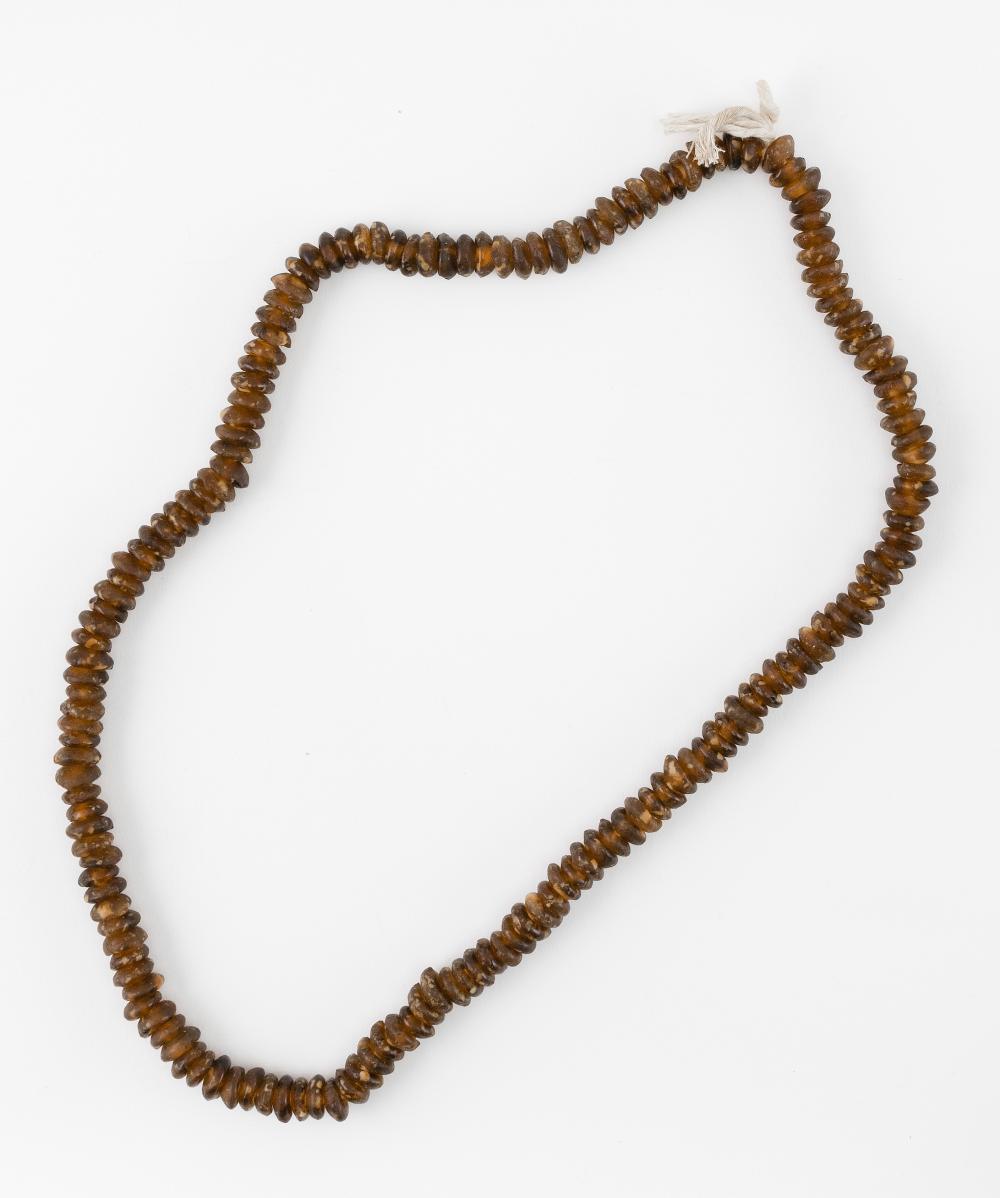 STRING OF AMBER-COLORED BEADS