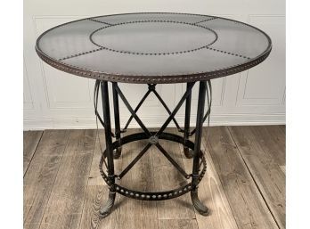 Studded metal table with round