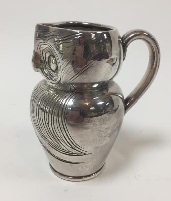 Style of Archibald Knox, a silvered