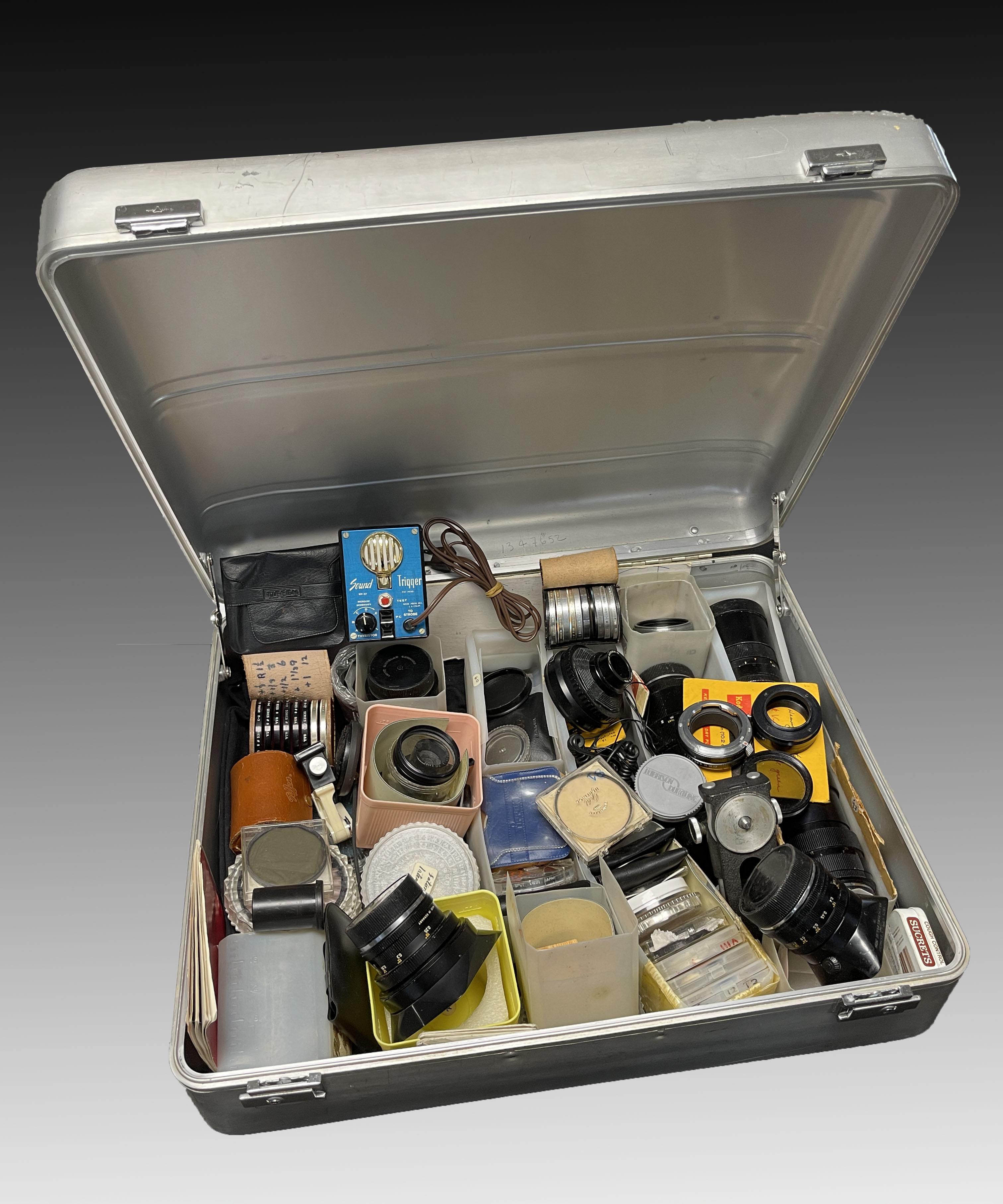 SUITCASE FULL OF LENSES AND