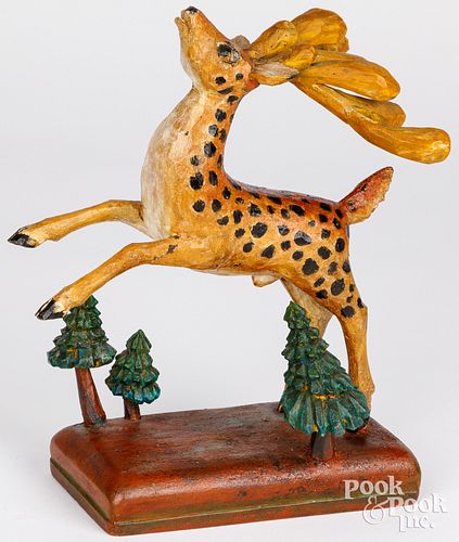 T. HEAD, CARVED AND PAINTED LEAPING
