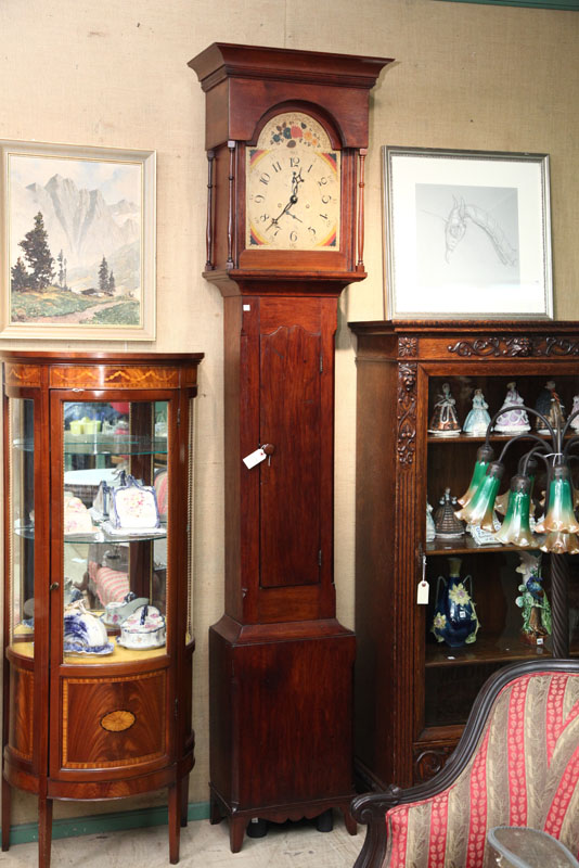 TALL CASE CLOCK. Walnut and