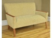 Tan ipholstered settee by Pomp