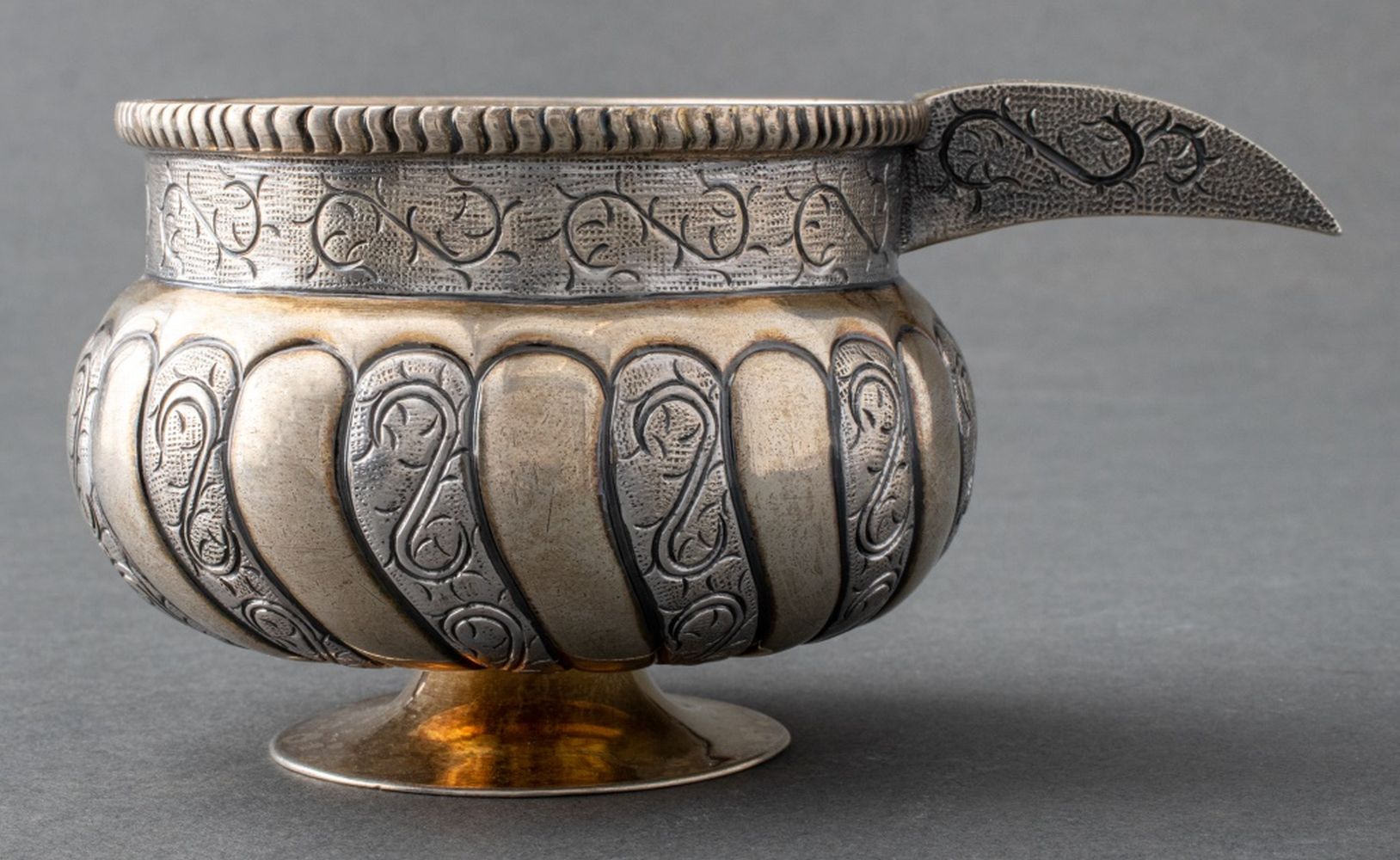 TANE MEXICAN SILVER AND PARCEL GILT