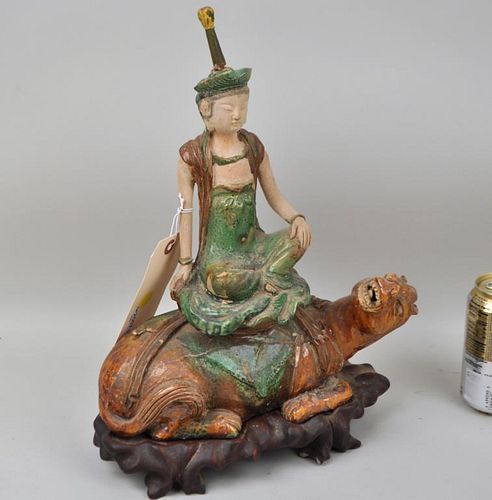 TANG DYNASTY POTTERY SEATED DEITY