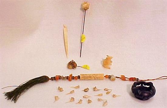 Tassel with carved stone figures