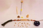 Tassel with carved stone figur