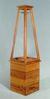 Teakwood and glass four-gun di