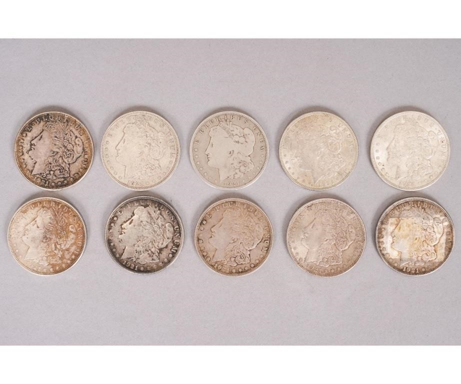 Ten 1921 Morgan silver dollars.