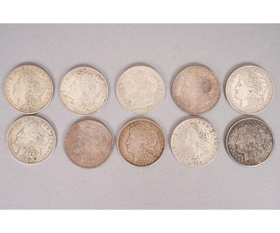 Ten 1921 Morgan silver dollars.