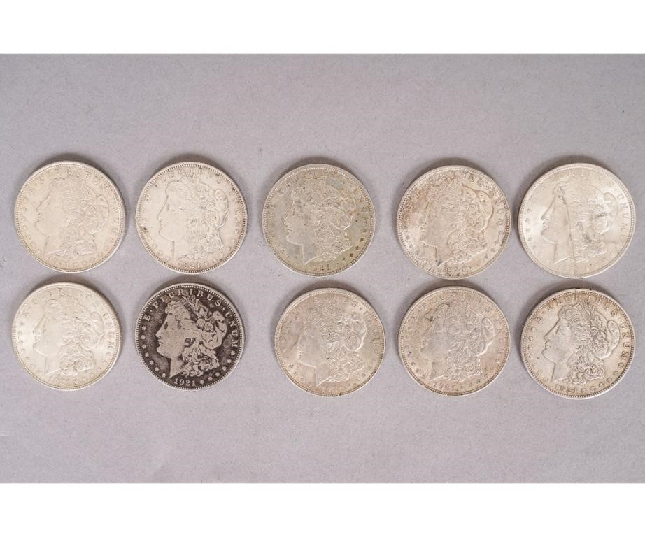 Ten 1921 Morgan silver dollars.