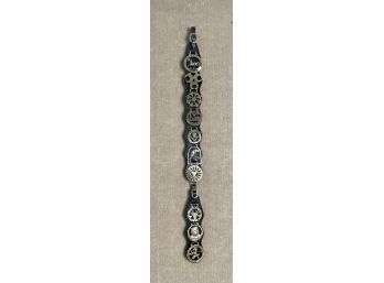 Ten antique horse brasses on a