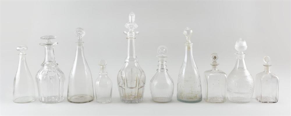 TEN BLOWN CLEAR GLASS DECANTERS