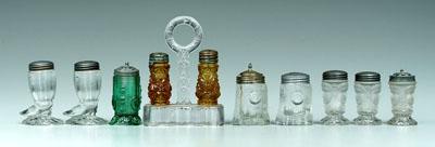 Ten pressed glass shakers,