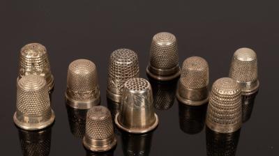 Ten silver thimbles, various