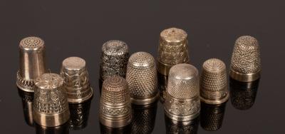 Ten silver thimbles, various