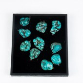 TEN TURQUOISE STONES MOUNTED A
