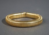 TESTED 18-KARAT YELLOW-GOLD 'T