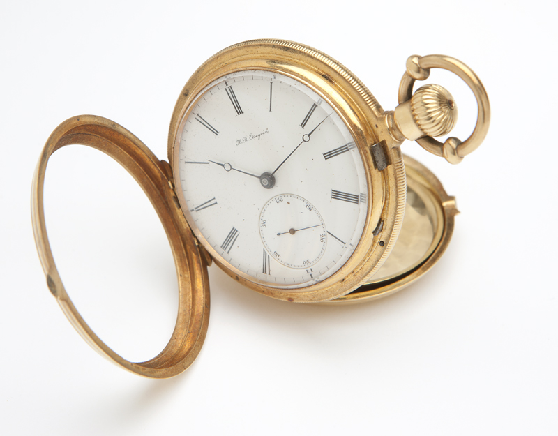 The circular white porcelain dial