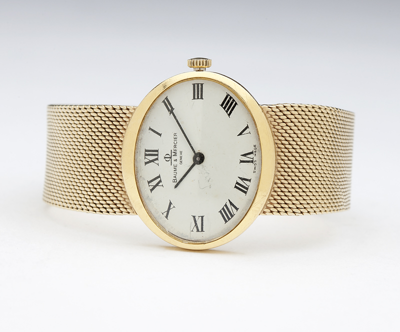 The elliptical white dial with