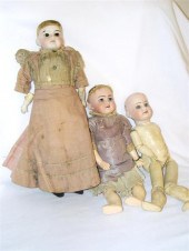 Thee German bisque dolls: (a)