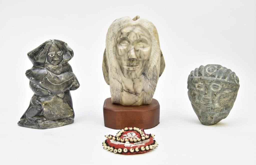 There stone carvings including an