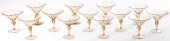 THIRTEEN BLOWN AMBER GLASS STE