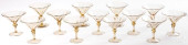 THIRTEEN BLOWN AMBER GLASS STE
