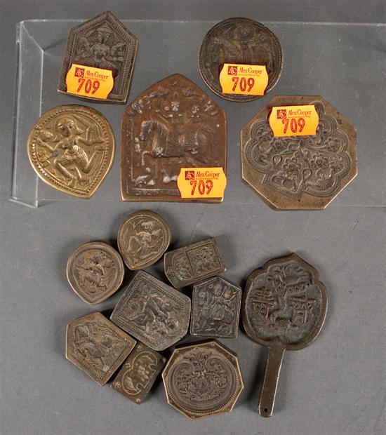 Thirteen Indian brass or bronze