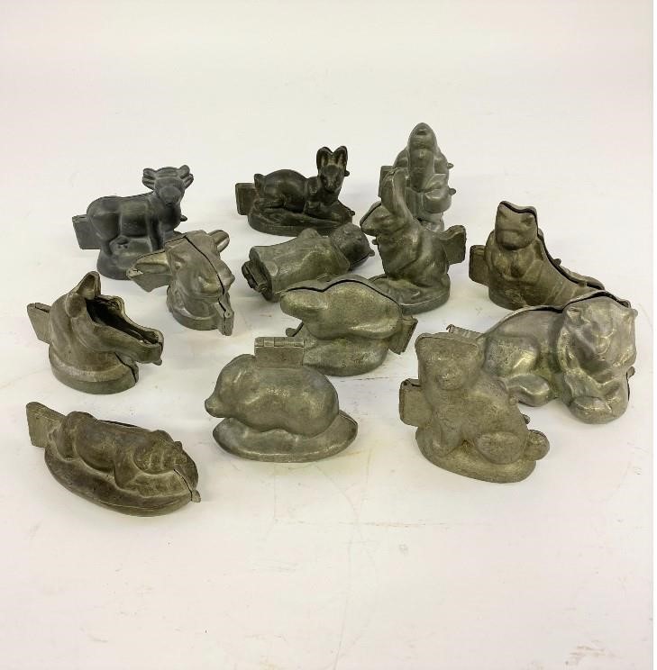 Thirteen pewter animal and Santa