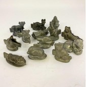 Thirteen pewter animal and San
