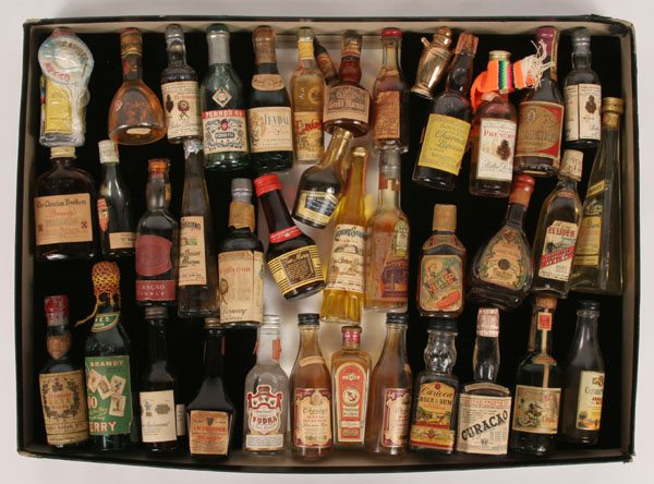 Thirty plus bottles of brandy, rum,