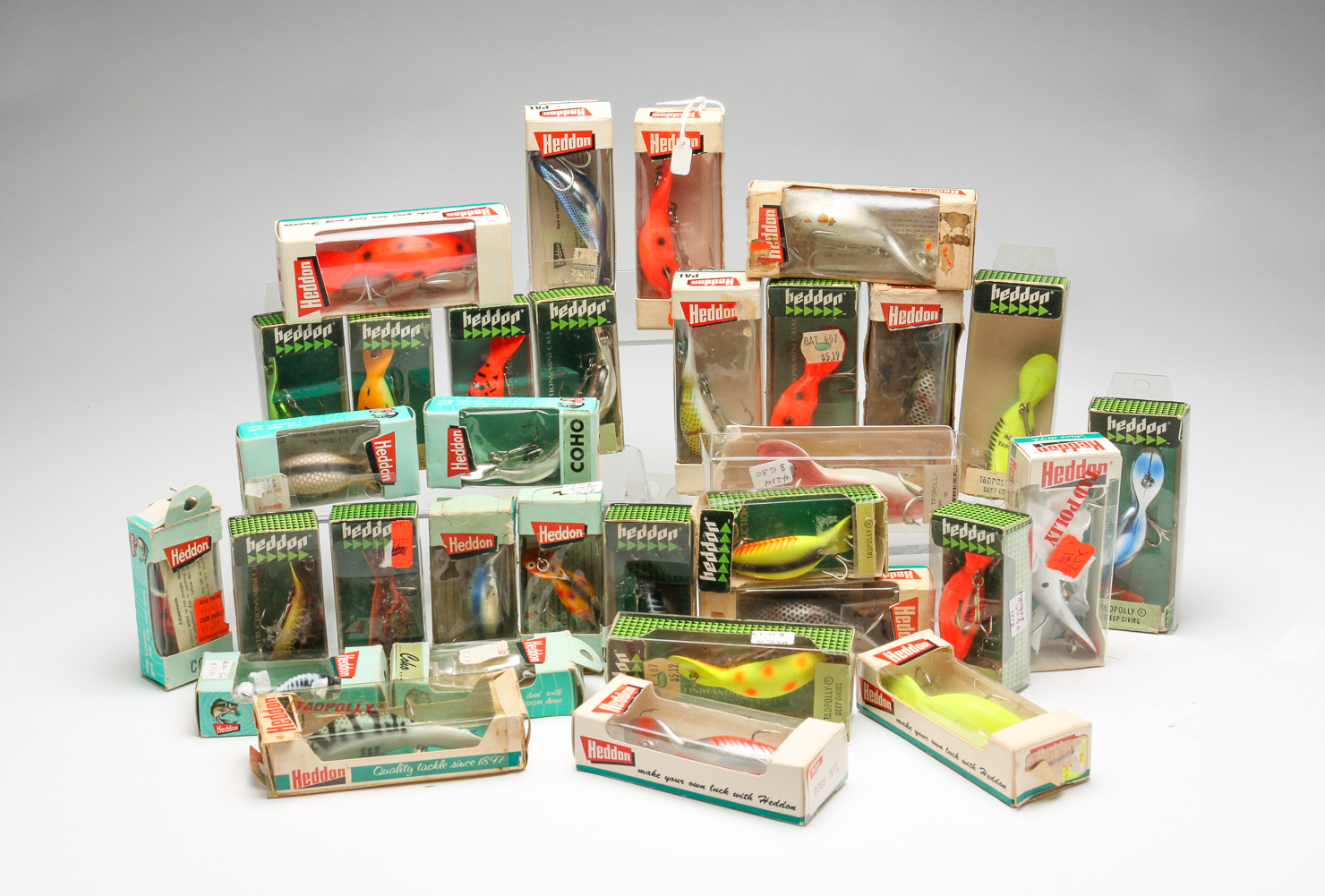THIRTY-TWO BOXED HEDDON LURES. Late