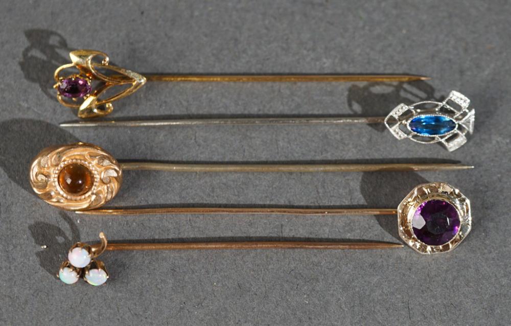 THREE 10-KARAT GOLD STICKPINS AND