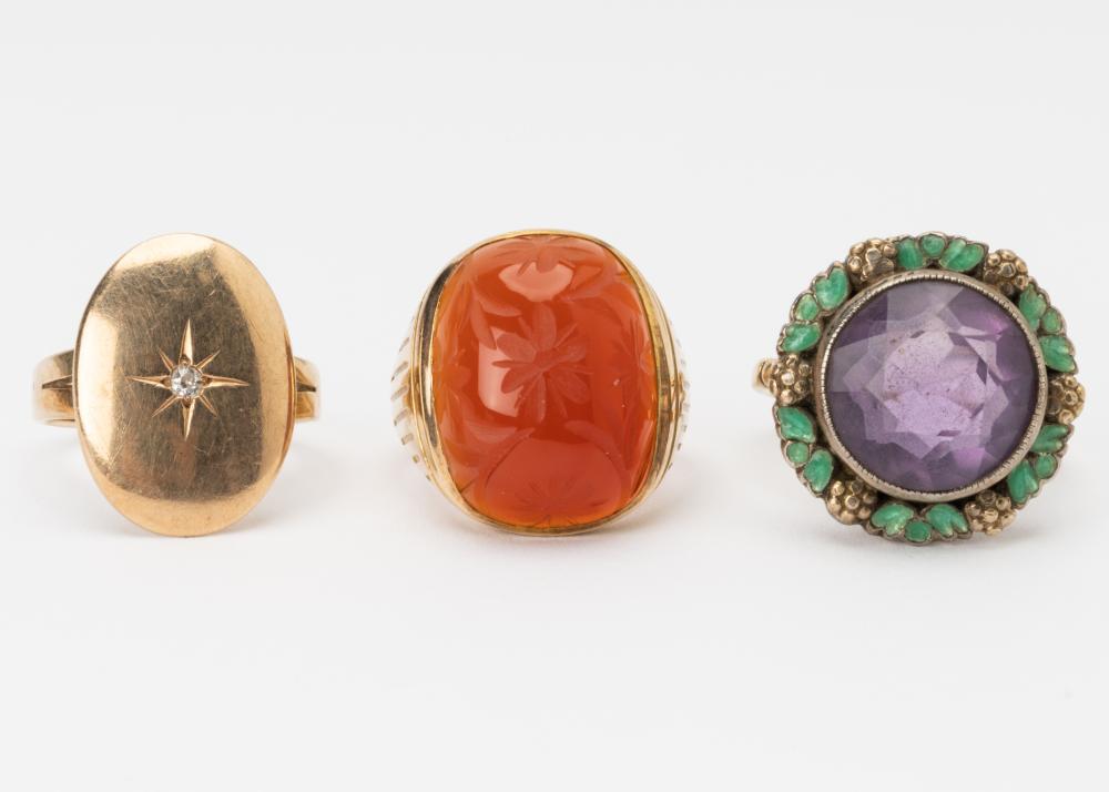 THREE 10 KARAT YELLOW GOLD,