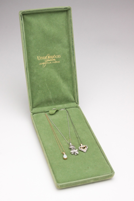 THREE 10K GOLD PENDANTS. Late