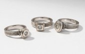 THREE 14 KARAT WHITE GOLD AND