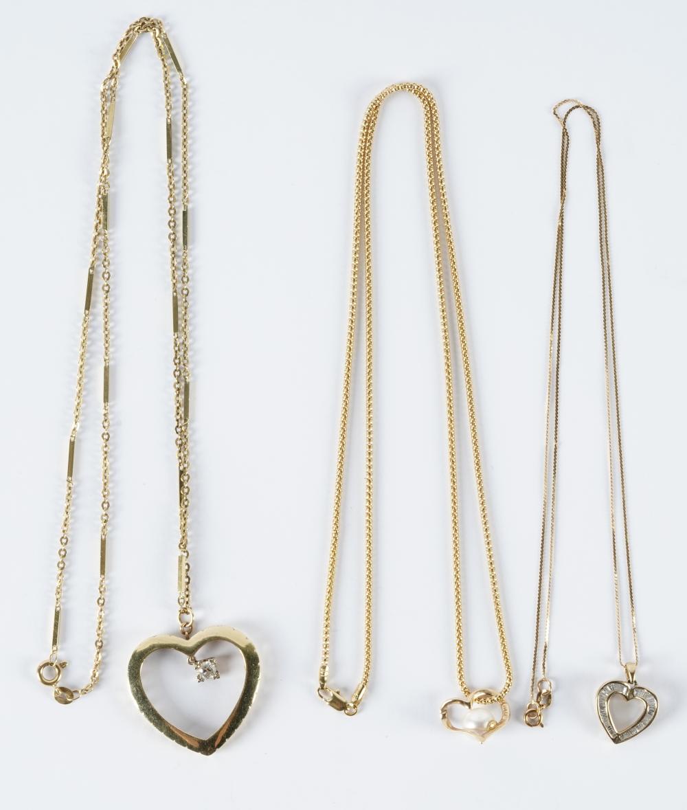 THREE 14 KARAT YELLOW GOLD HEART
