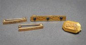 THREE 14-KARAT YELLOW-GOLD PIN
