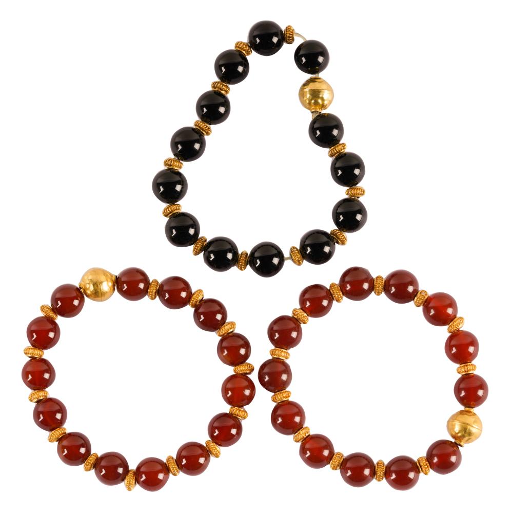 THREE 18 KARAT YELLOW GOLD,