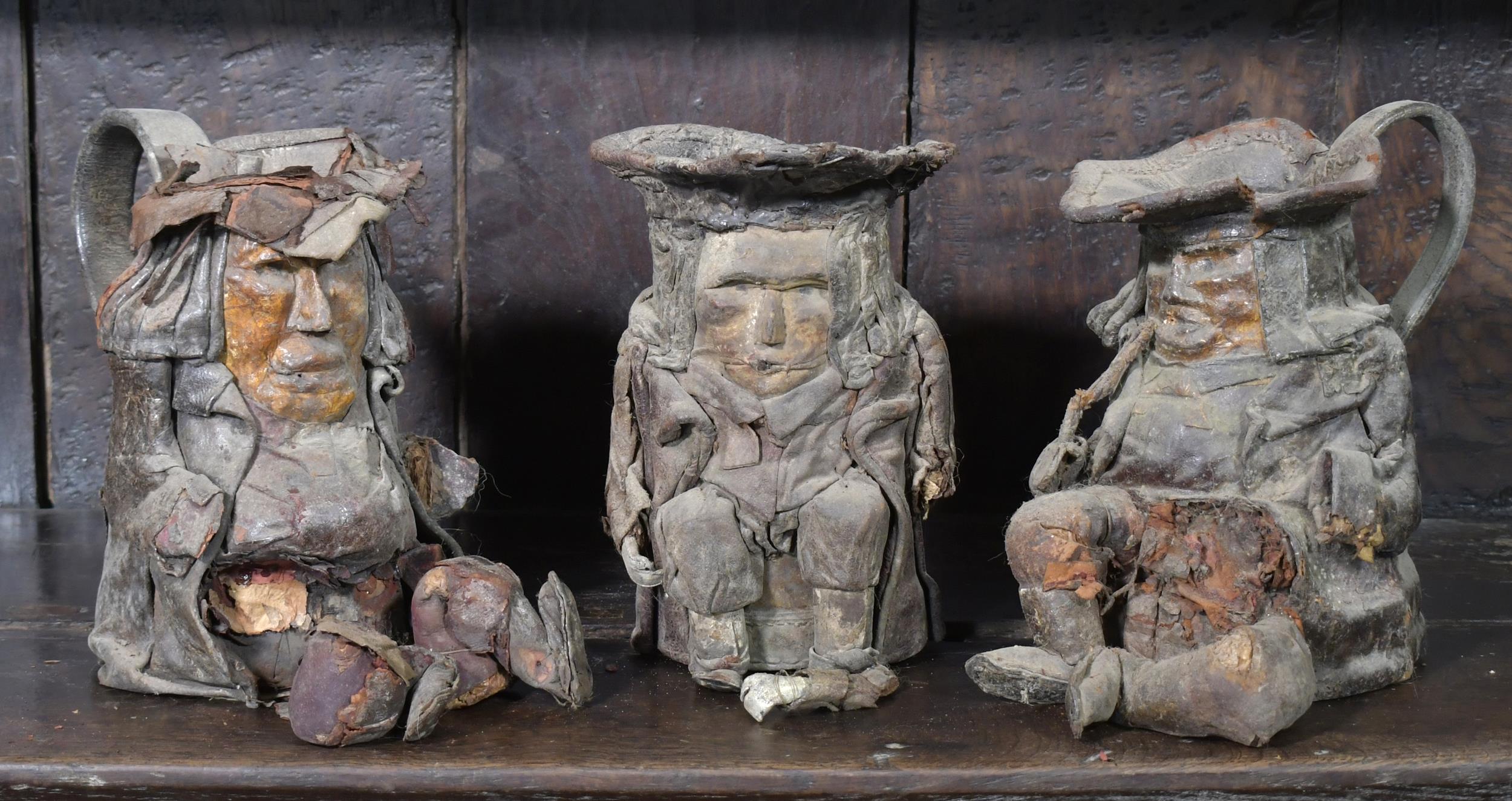 THREE 18TH C. LEATHER TOBY JUGS.