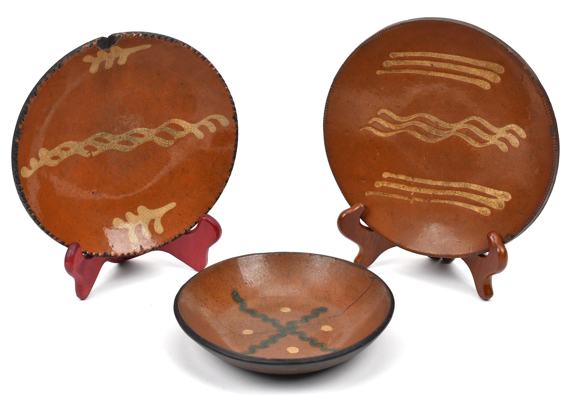 THREE 19TH C. REDWARE PLATES. Two