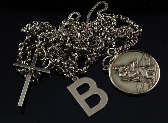 Three 9ct gold chains hung with