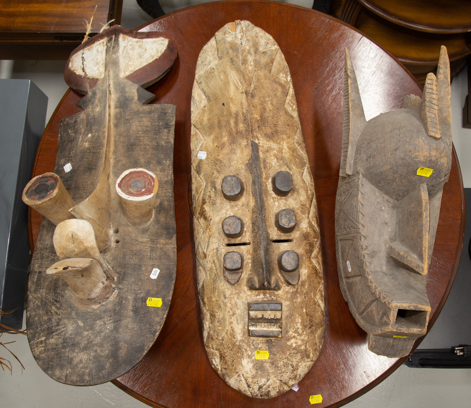 THREE AFRICAN CARVED WOOD MASKS