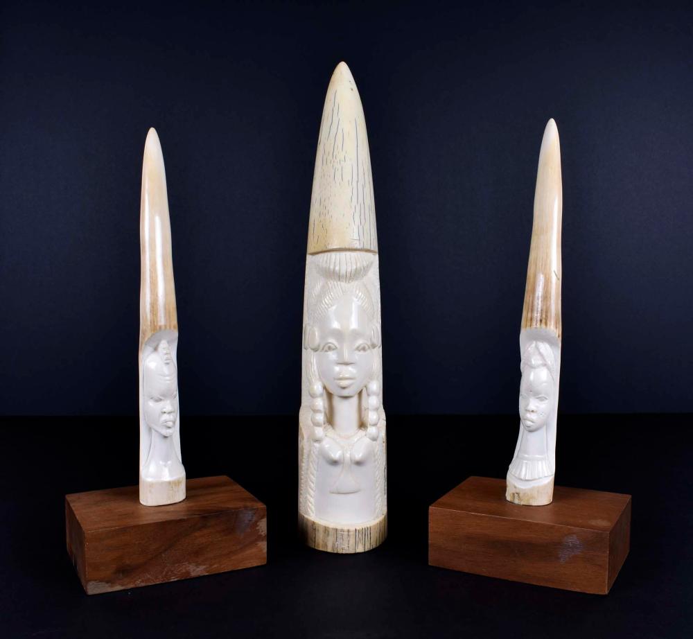 THREE AFRICAN CARVINGS OF MEN &