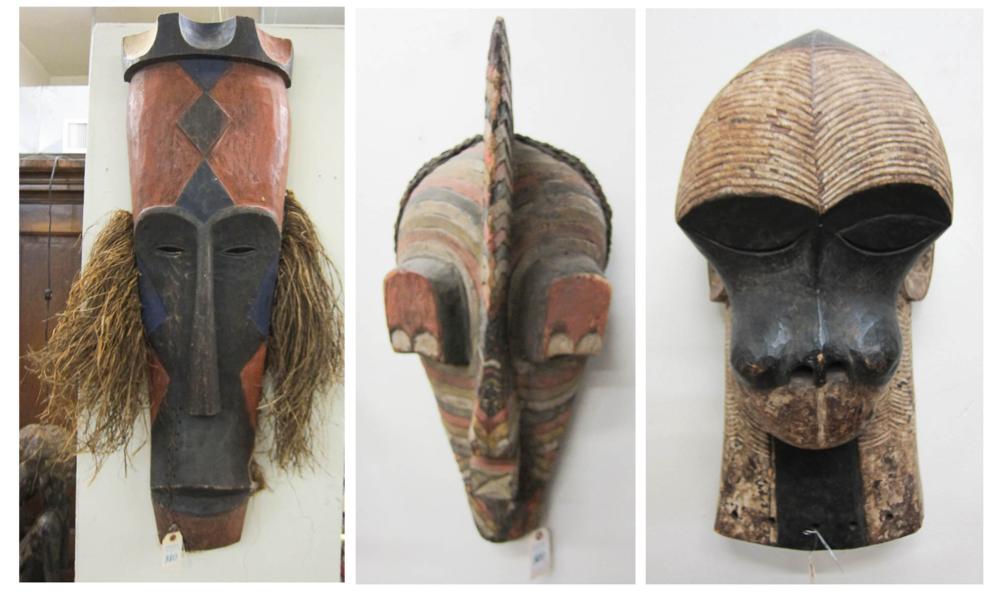 THREE AFRICAN WOOD TRIBAL MASKS: